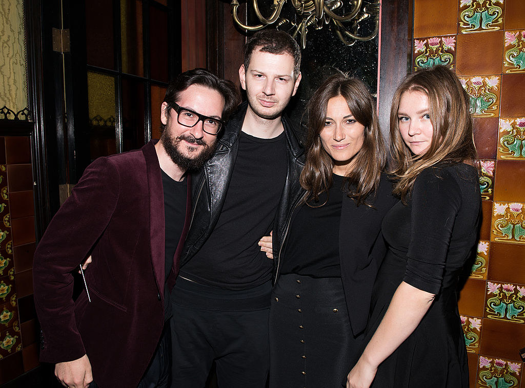 Anna Sorokin hanging out with a group of people outside a club