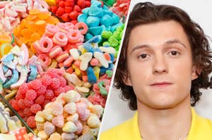 A bunch of candy is on the left with Tom Holland on the right