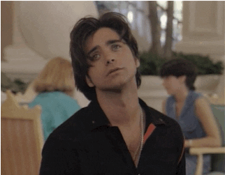 Uncle Jesse smiling while singing