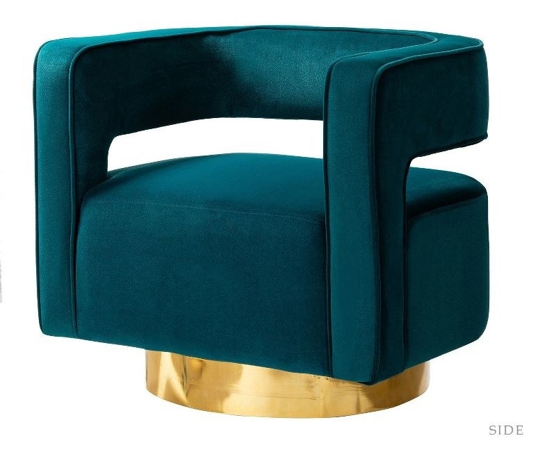 a swivel barrel chair in teal and gold