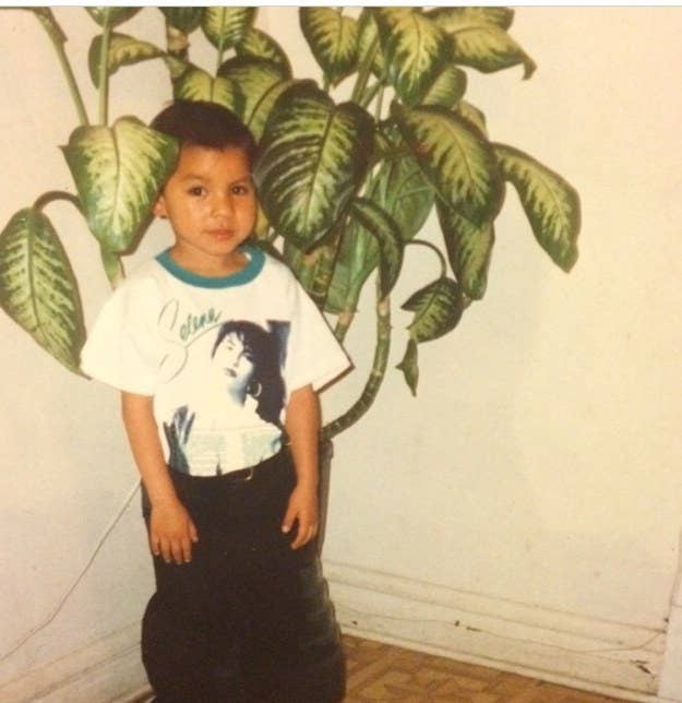 small kid in a selena T-shirt and lip gloss