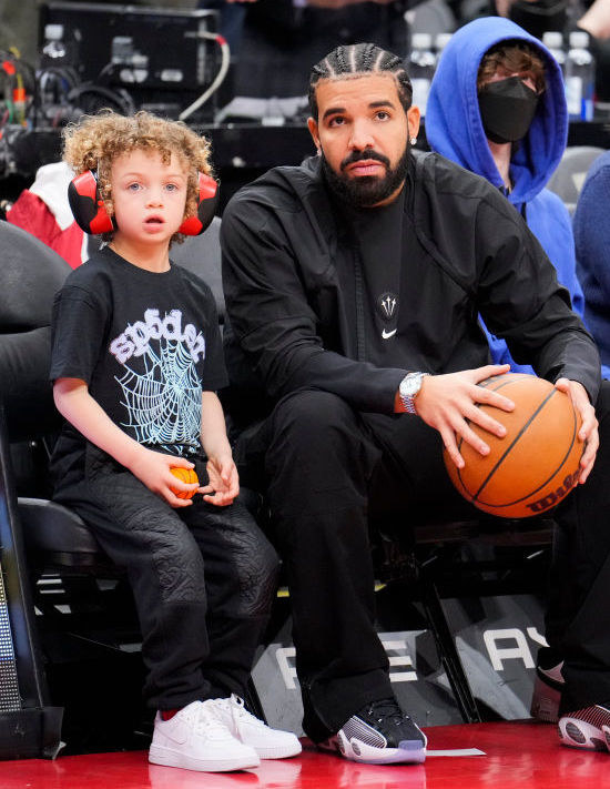 Adonis at a basketball game with Drake in 2022