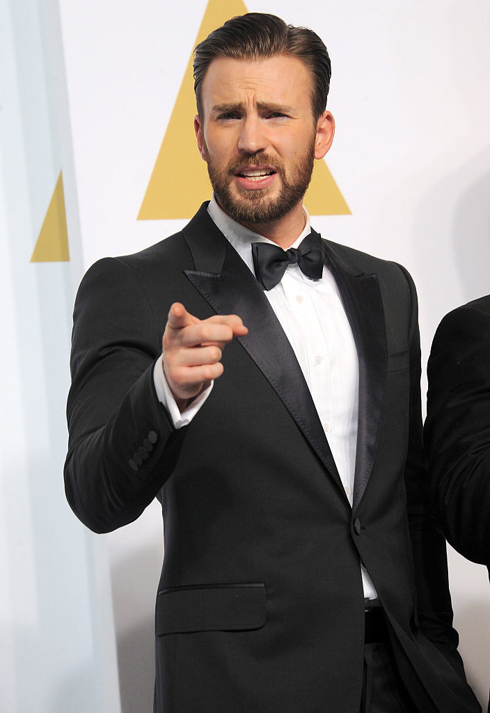 Chris Evans pointing and wearing a tux