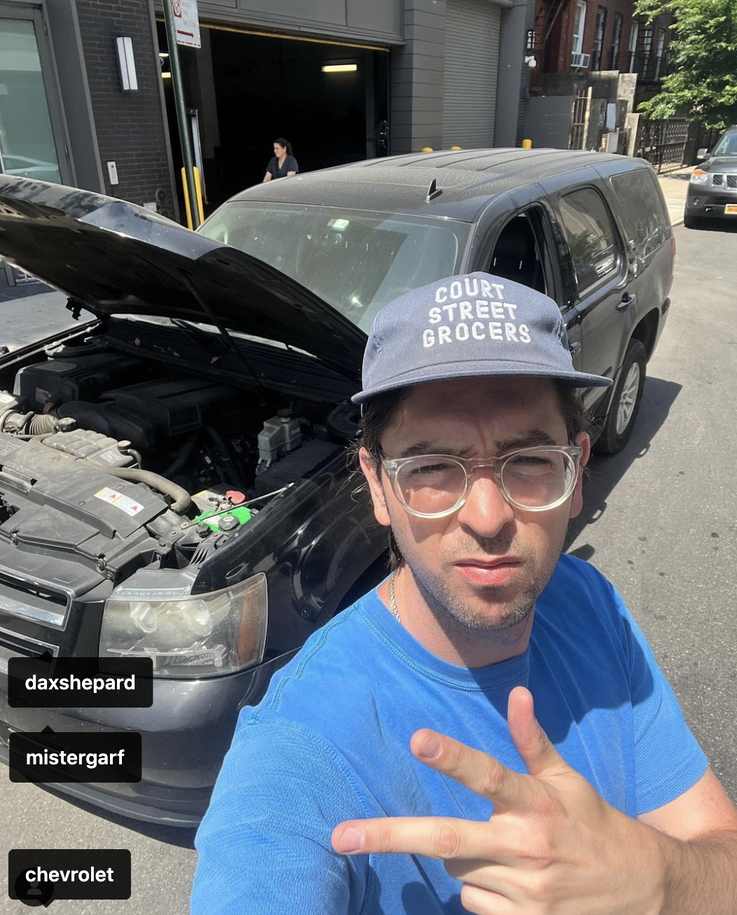 Screenshot of Nicholas in front of the car