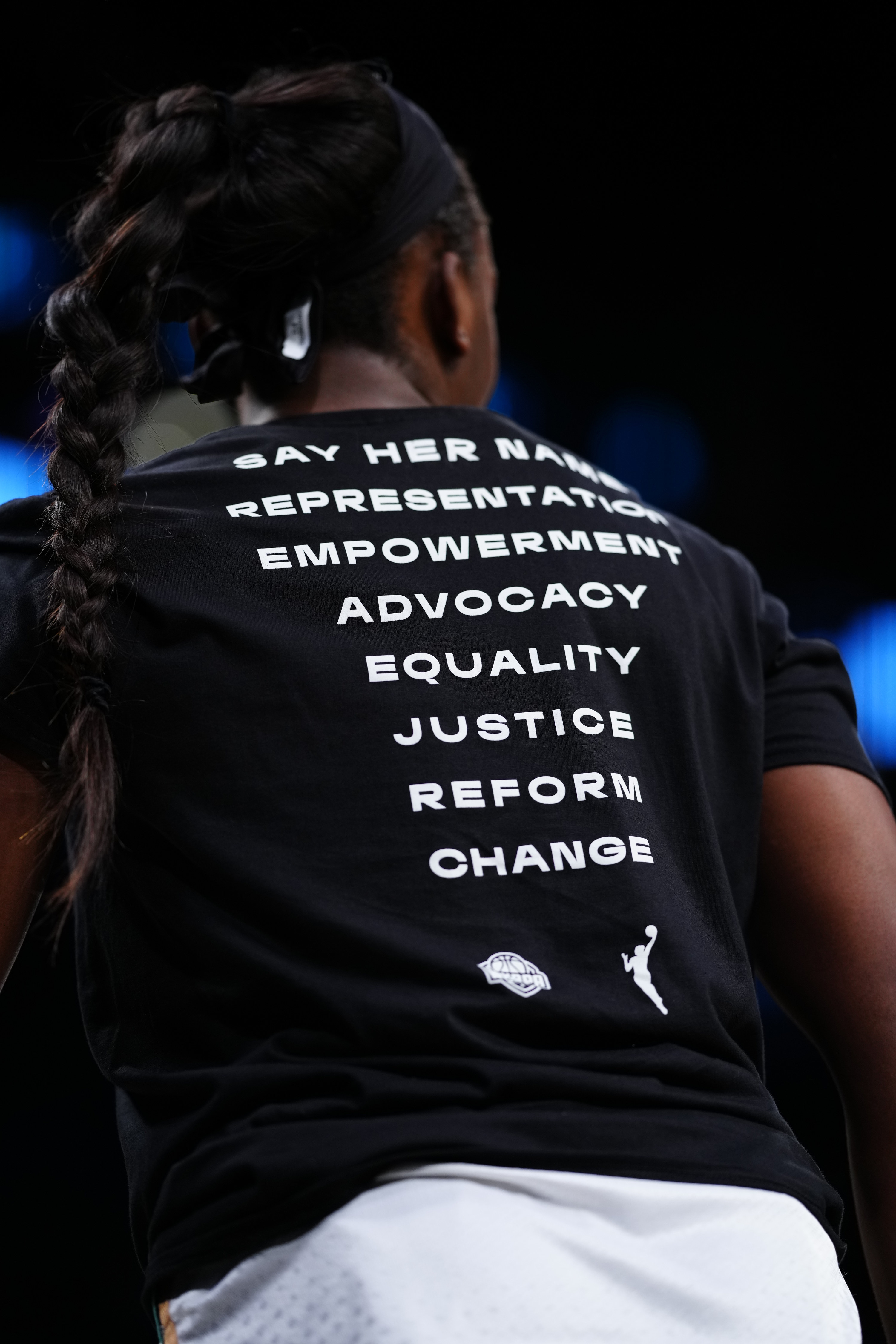A girl wears a Black Lives Matter shirt
