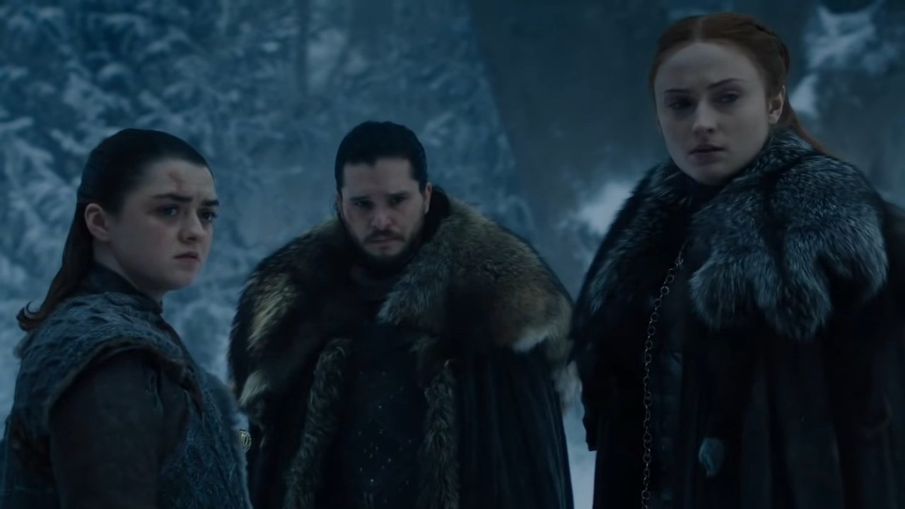 Arya, Jon, and Sansa standing in the snow in &quot;Game of Thrones&quot;