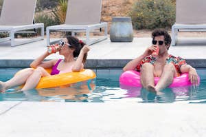 Christin Miloti and Andy Samberg sit in a pool in inner tubes drinking something out of cans as Sarah and Nyles in Palm Springs