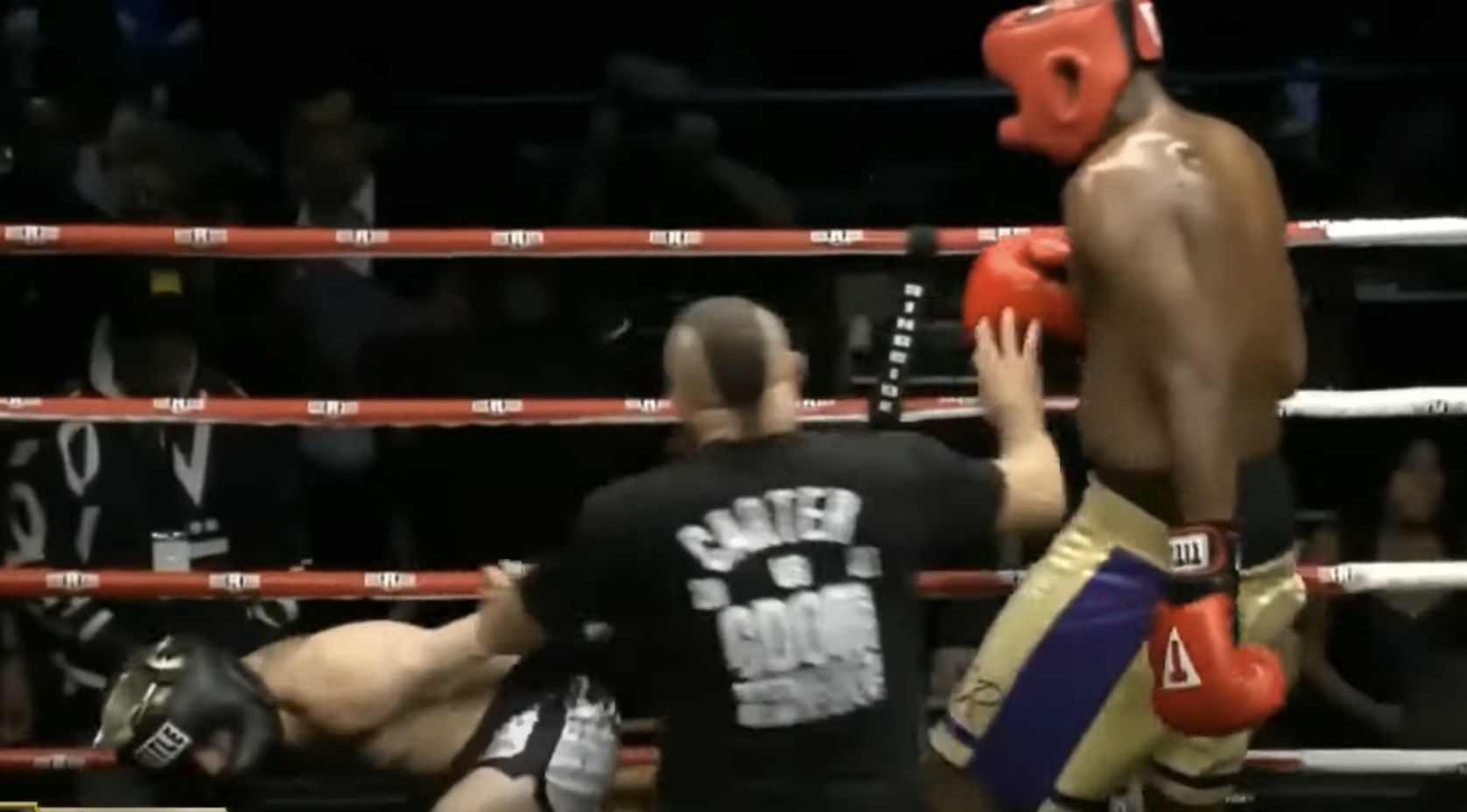Carter falls backward on one knee after being hit by Odom