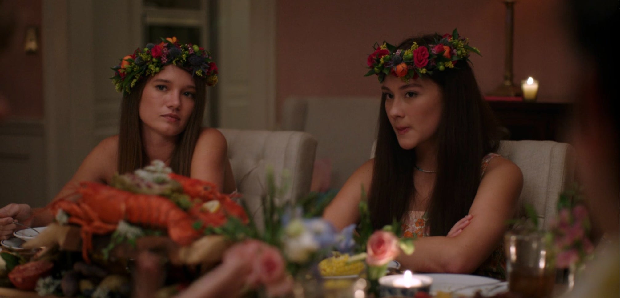 close up of a teen wearing a large floral headpiece