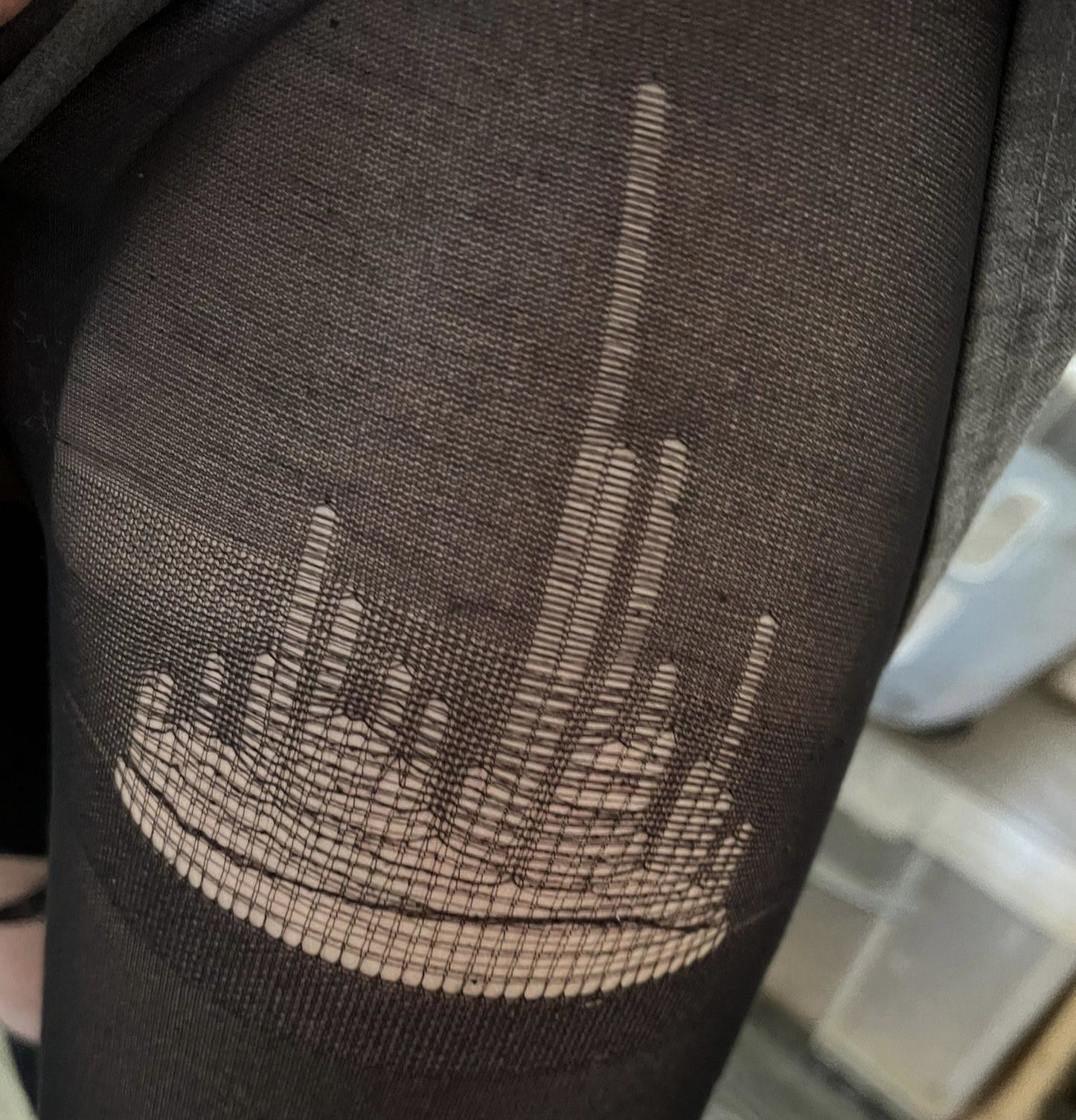 torn tights with a hole that looks like a city skyline