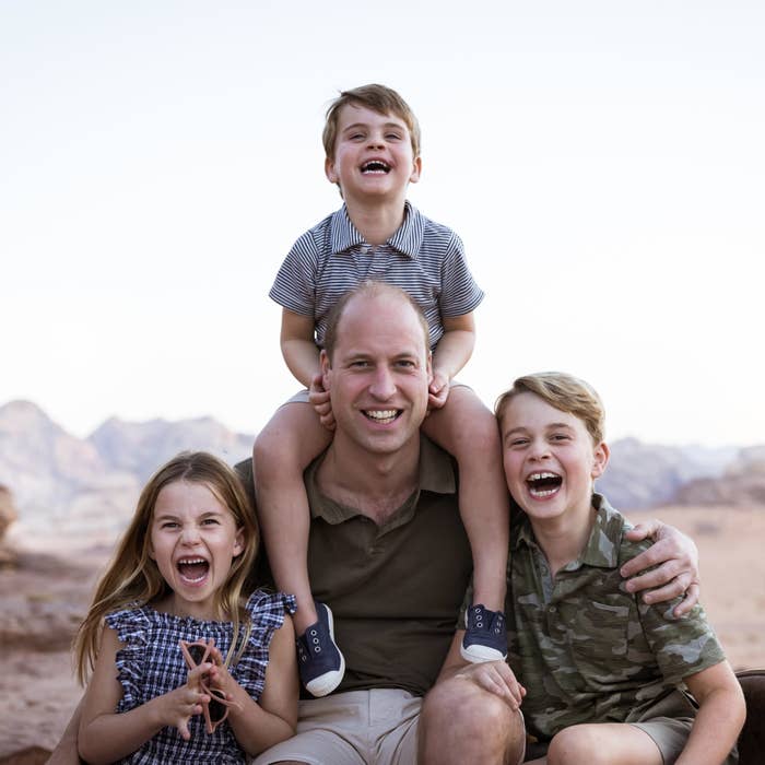 Charlotte, William, Louis on Williams&#x27; shoulder, and George all smiling