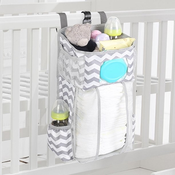 Diaper organizer hanging from crib