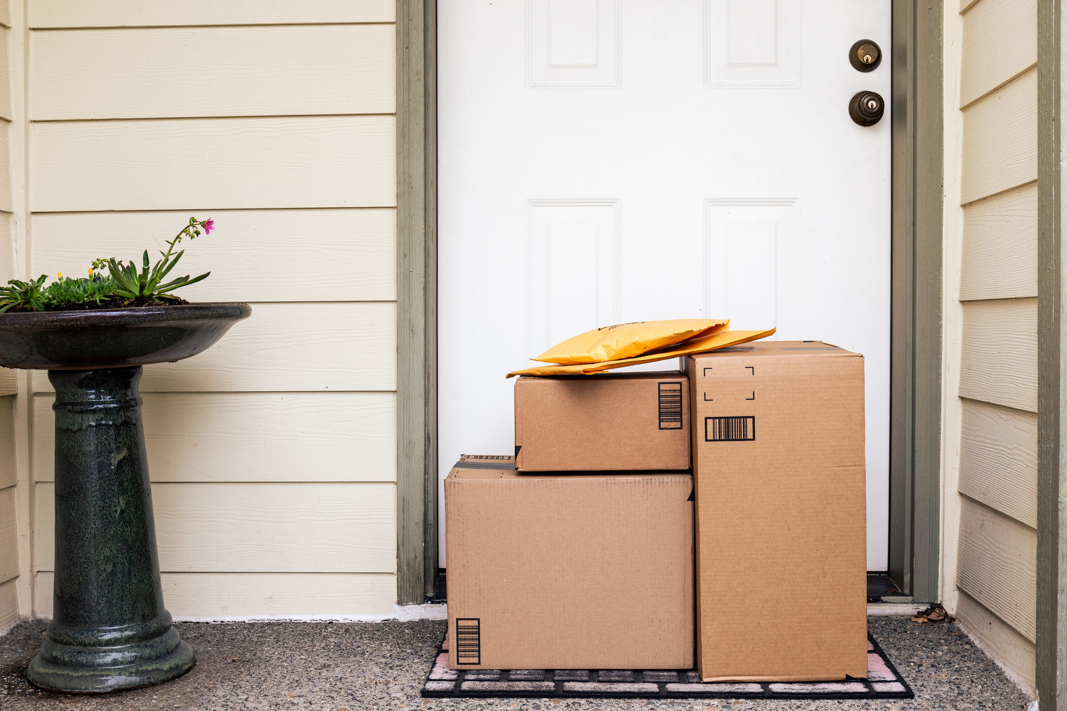 Packages sit at a front door