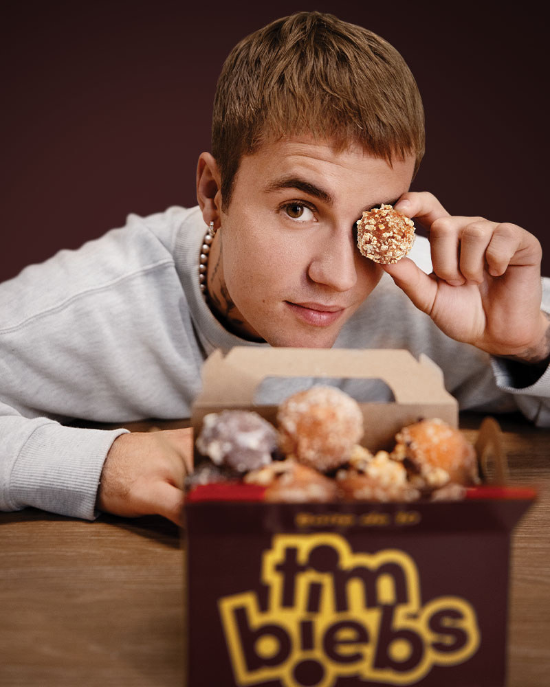 Justin Bieber poses with a box of donut balls, the box says &#x27;Tim Biebs&#x27;