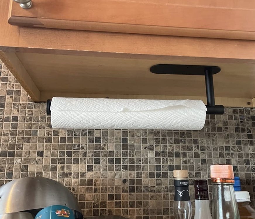 reviewer photo showing the paper towel holder installed under their upper cabinets