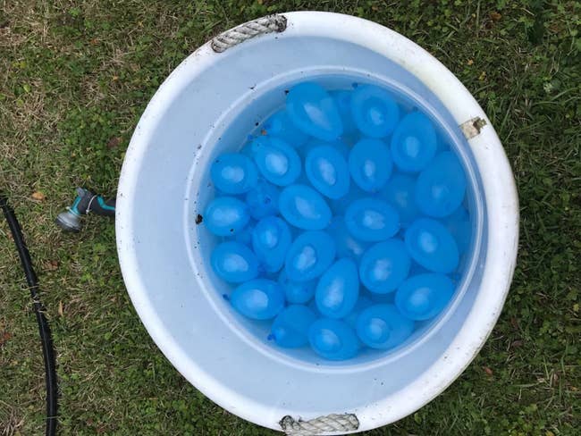 reviewer's photo of water balloons in a bucket