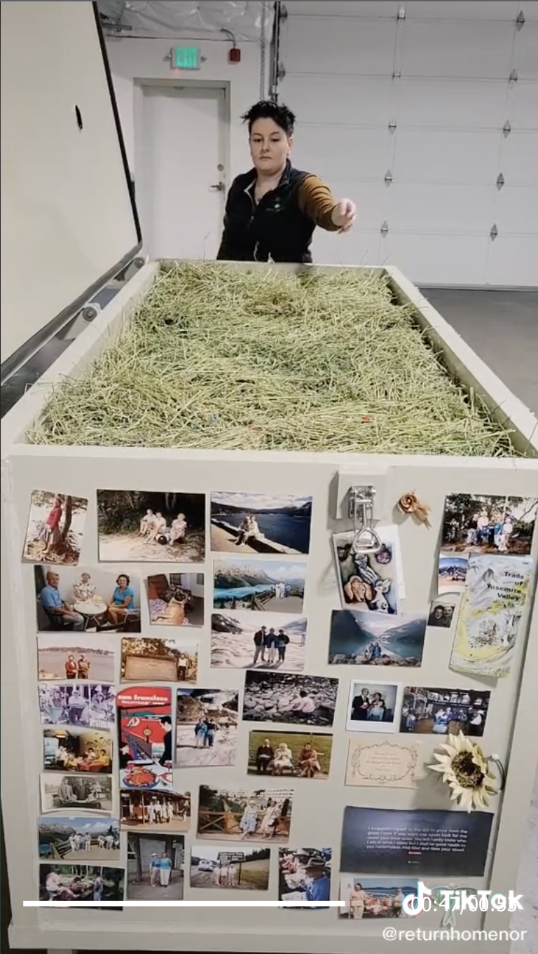 The bin that was covered with mementos is now pictures open and full of straw