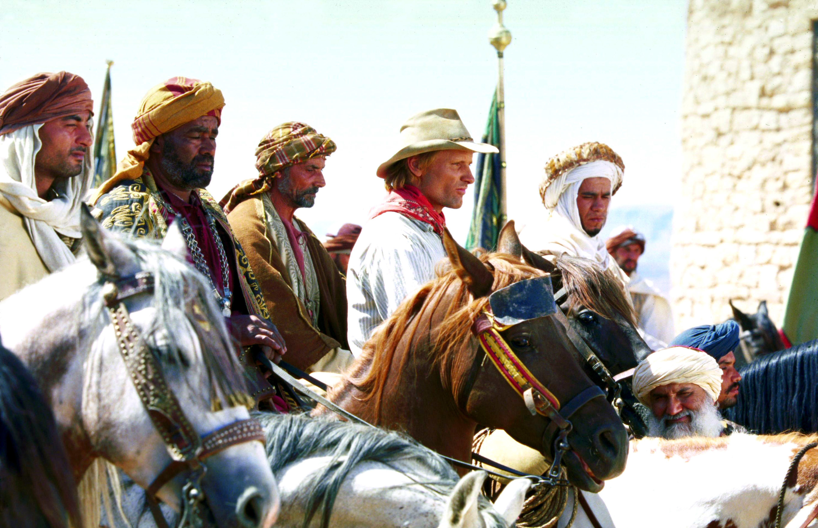 men lining up on horseback