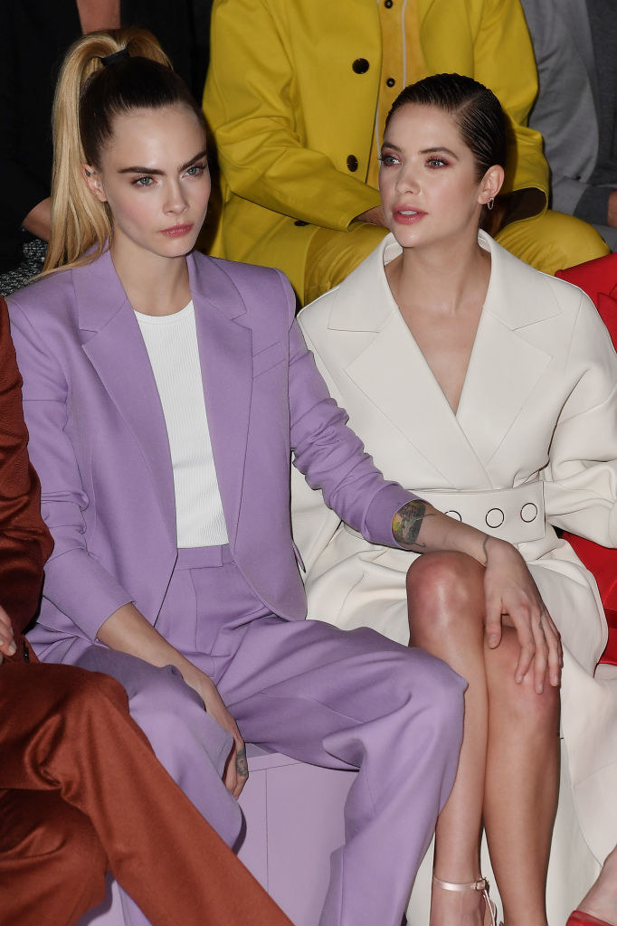the two sitting front row at a fashion show