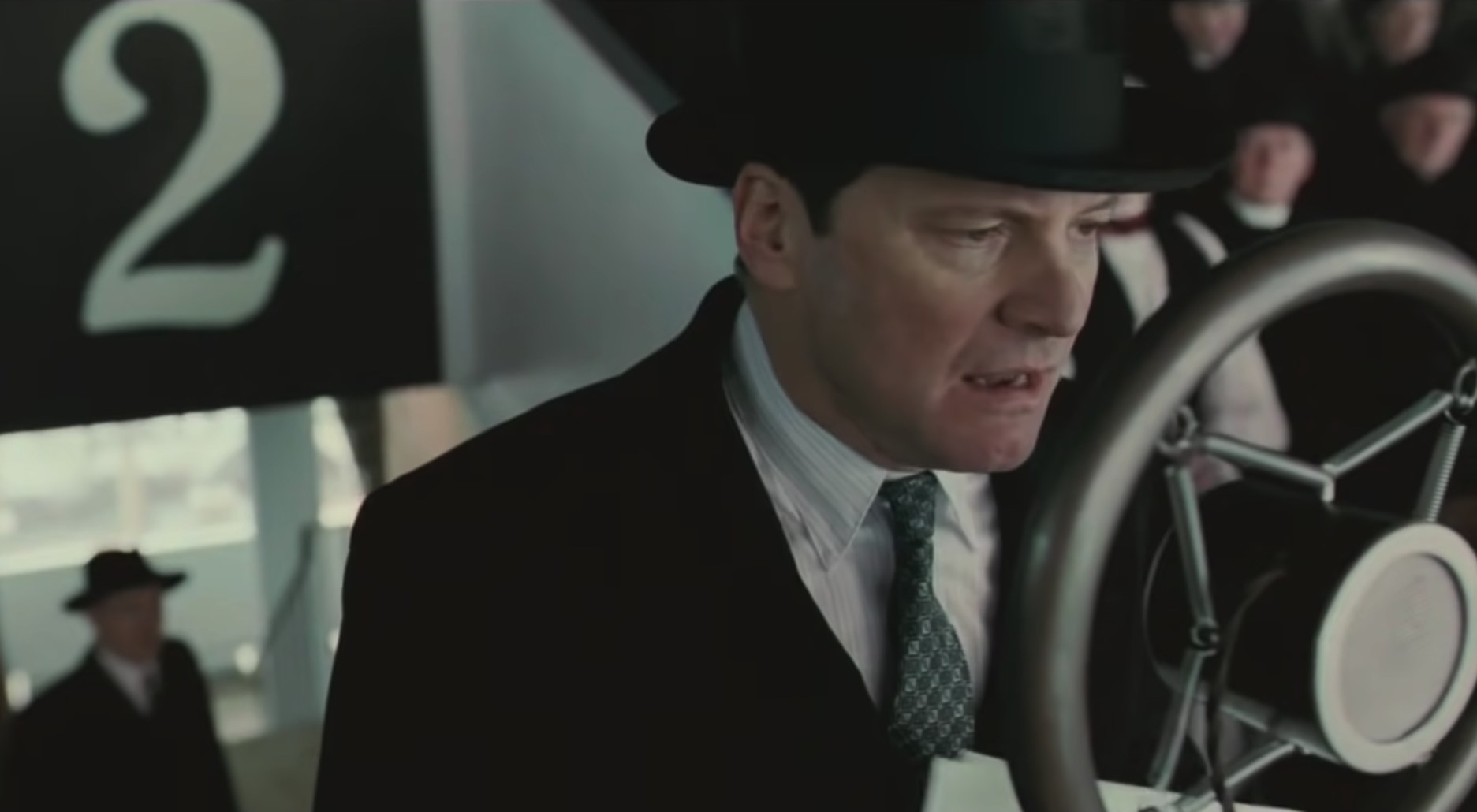 Colin Firth talking into a microphone in &quot;The King&#x27;s Speech&quot;