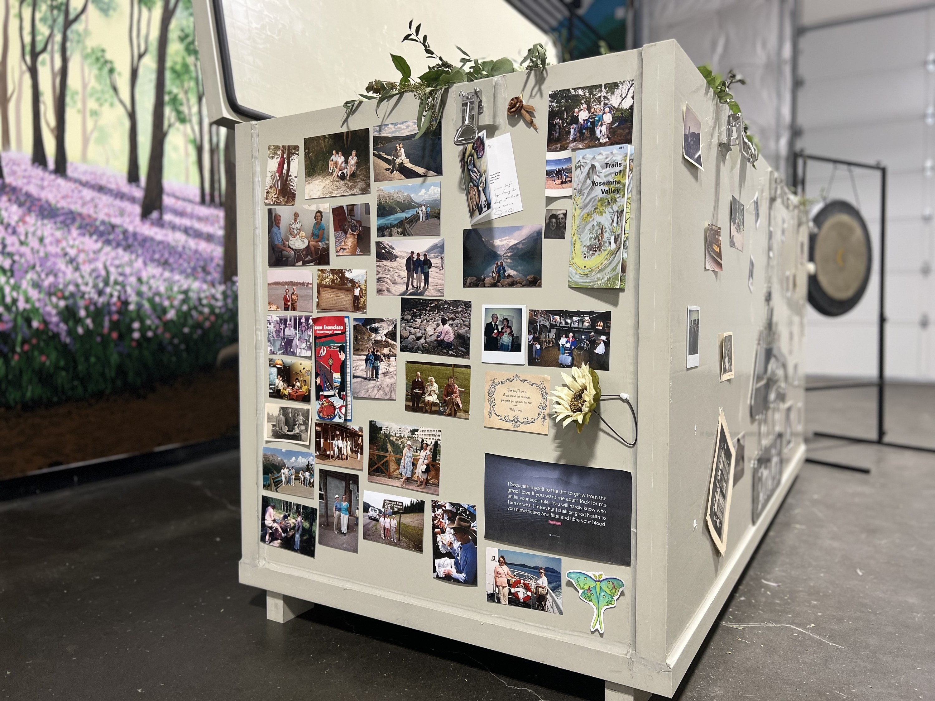 One of the large bins from a previous image, but this one is by itself and decorated with many photos, cards, and other mementos