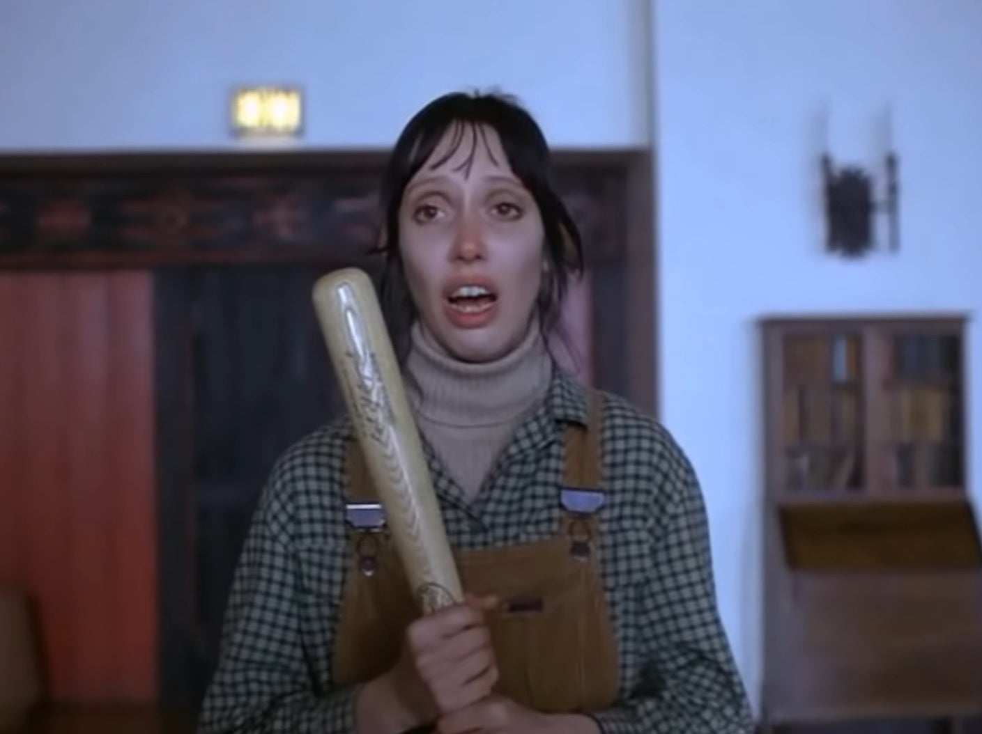 Wendy holding a bat in the Overlook Hotel lounge in &quot;The Shining&quot;