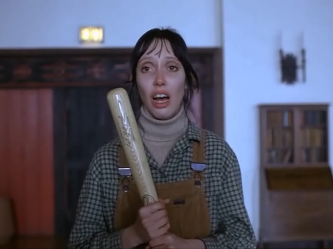 Wendy holding a bat in the Overlook Hotel lounge in &quot;The Shining&quot;