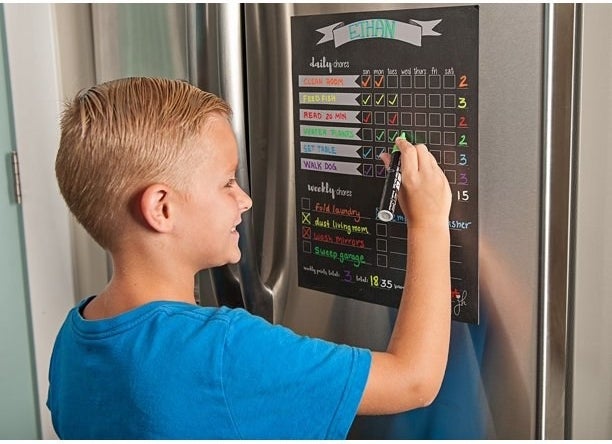 Boy filling out chart