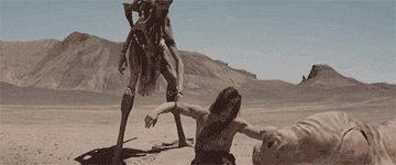 Taylor Kitsch as John Carter with CGI alien creatures in &quot;John Carter&quot;