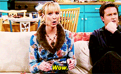 Phoebe from Friends sitting on a couch and saying wow