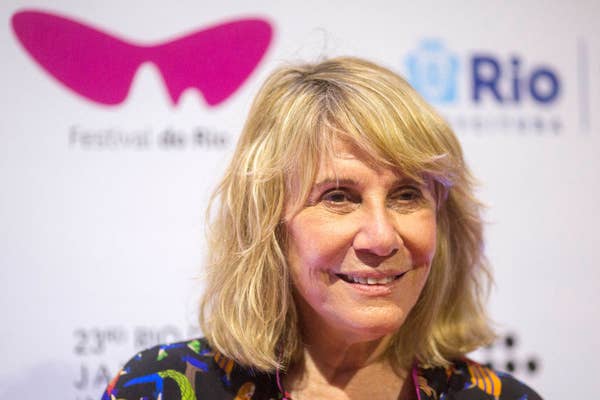 Headshot of woman smiling on the red carpet