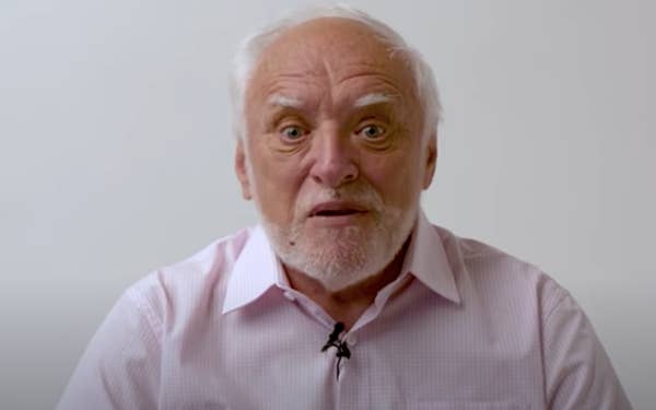 Head shot of older man with eyebrows raised