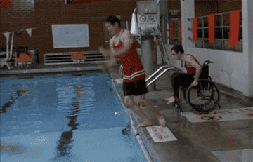 the students jumping into the pool