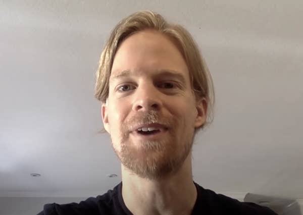 Man with a short beard and mustache gazing at the camera