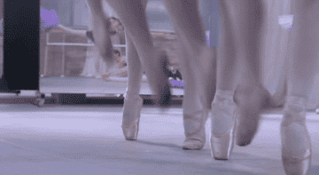 A Dance Academy scene showing the students performing ballet exercises