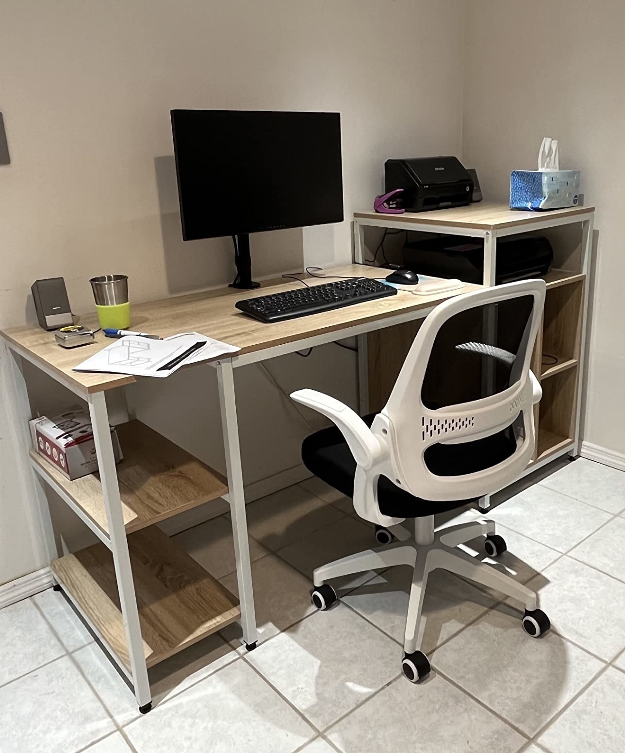 reviewer&#x27;s photo of the white back wheeled chair at a desk