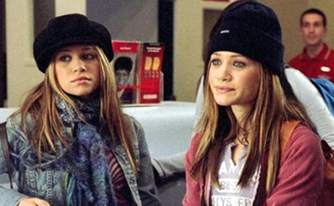 Mary Kate and Ashley look fed up wearing matching hats