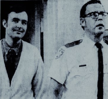 Gerard John Schaefer smiles while being escorted by police