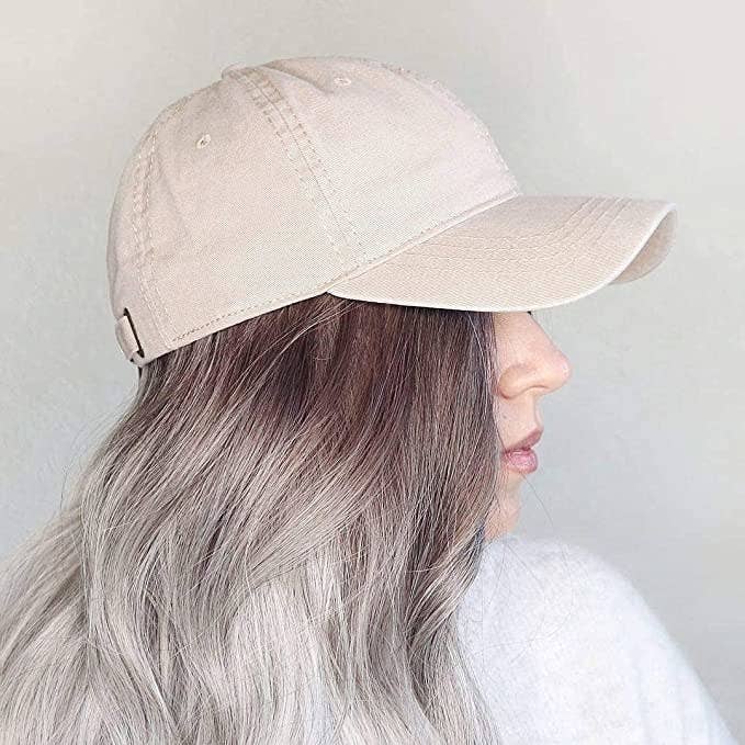 A person with ombré hair wearing the hat