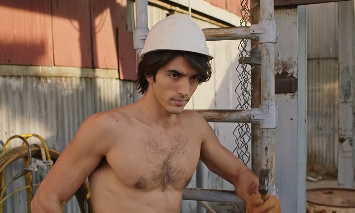 Taylor Zakhar Perez shirtless with a white hardhat on.