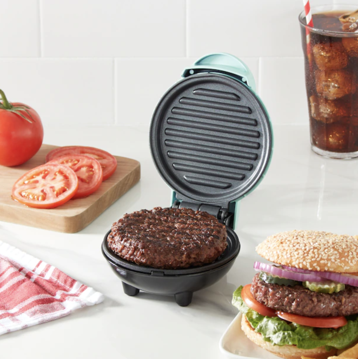 a mini griddle frying up a burger patty