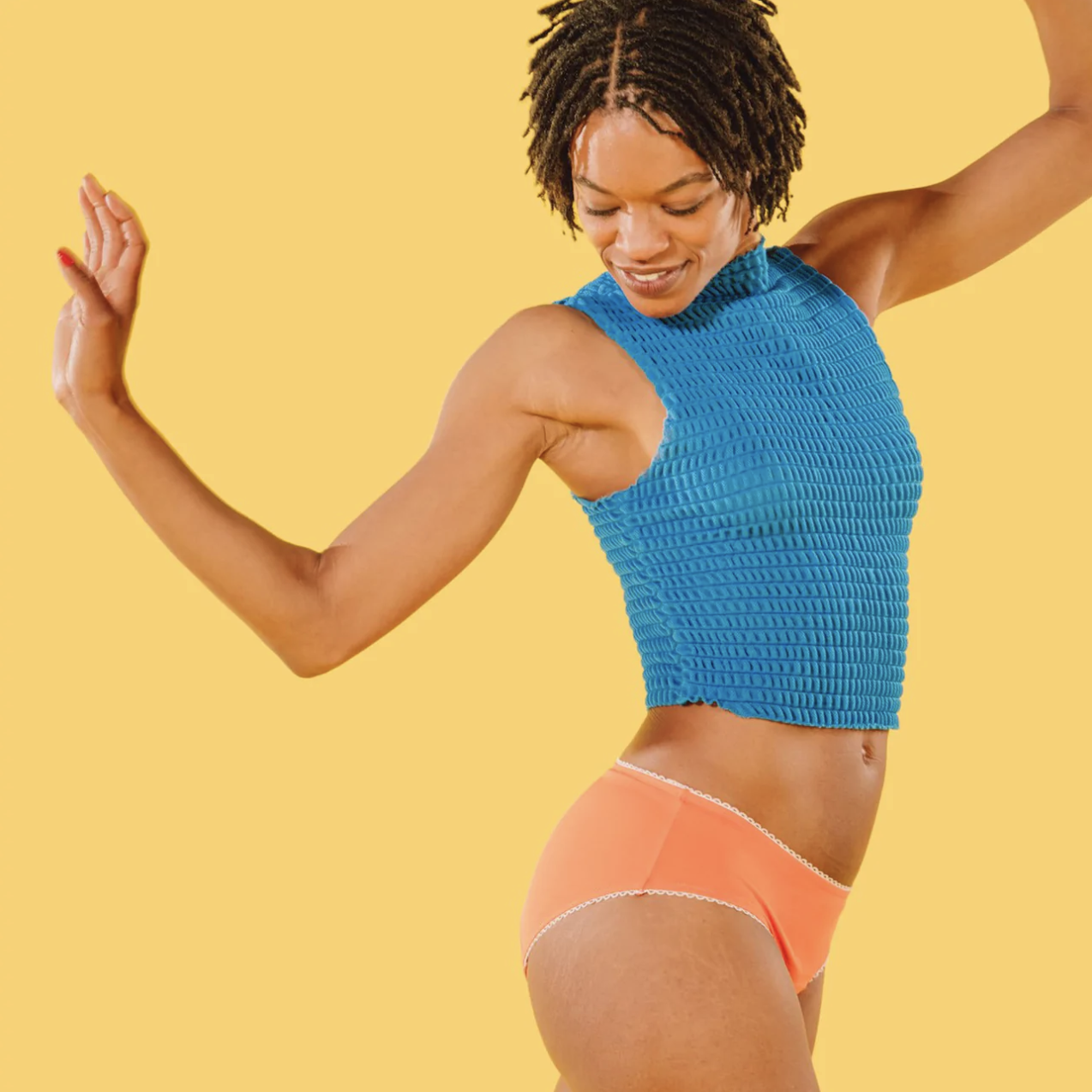 a person dancing while wearing a pair of the leakproof undies