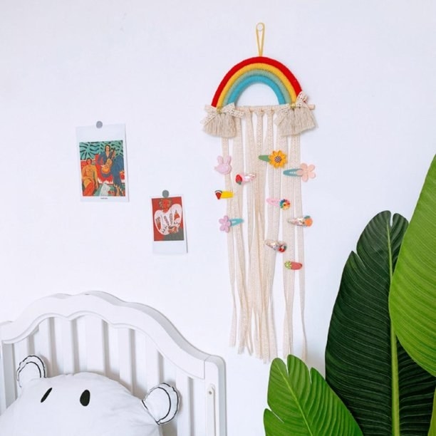 Rainbow hair clip holder hanging on wall in kids room