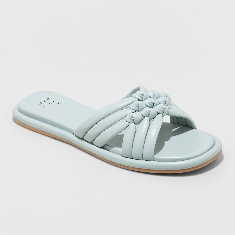 mint green slide sandals with a knotted criss cross strap
