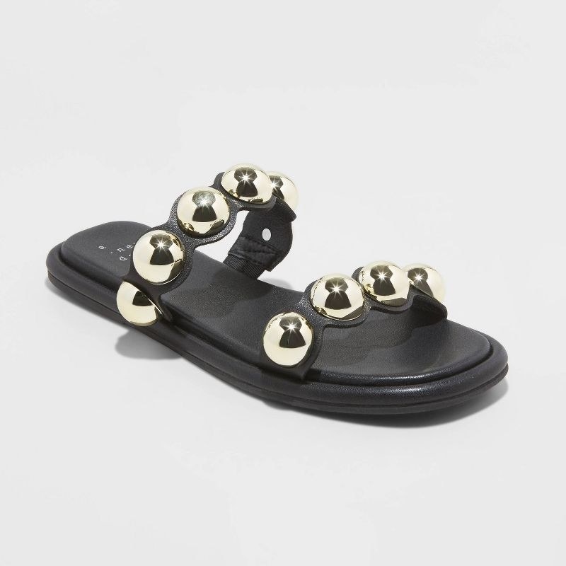 black sandals with two straps with metallic studs