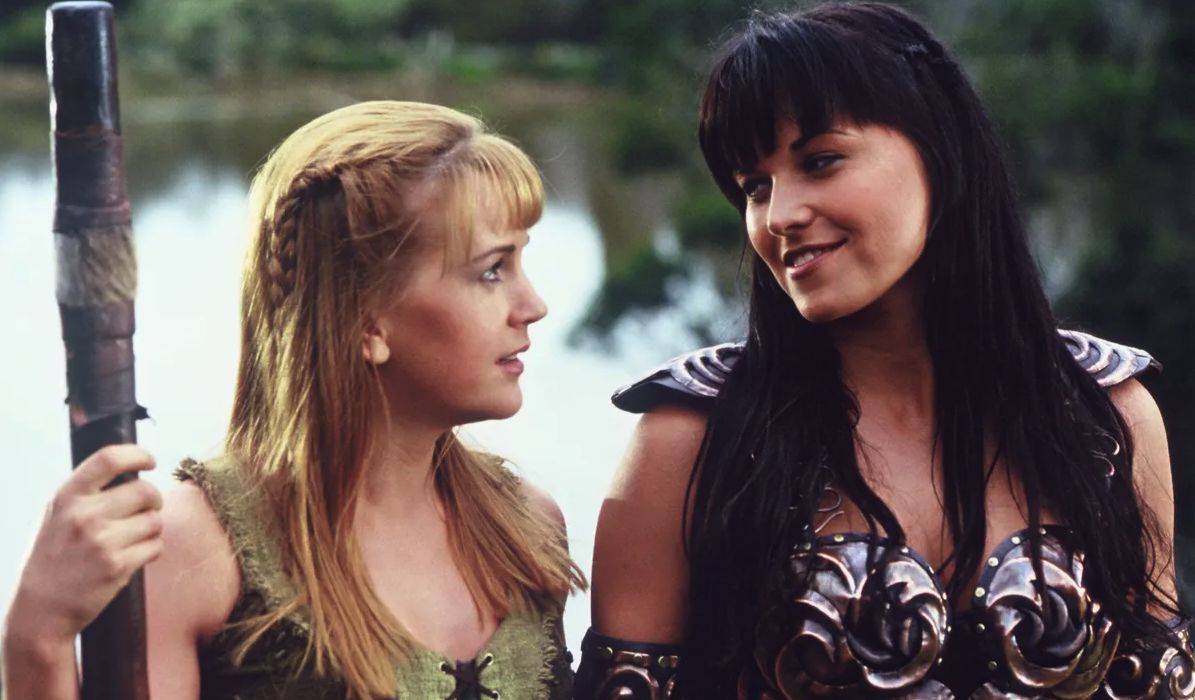 Xena and Gabrielle smiling while having a conversation with each other