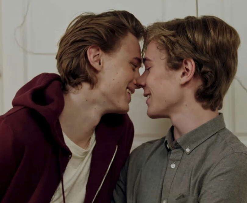 Isak and Even leaning in for a kiss