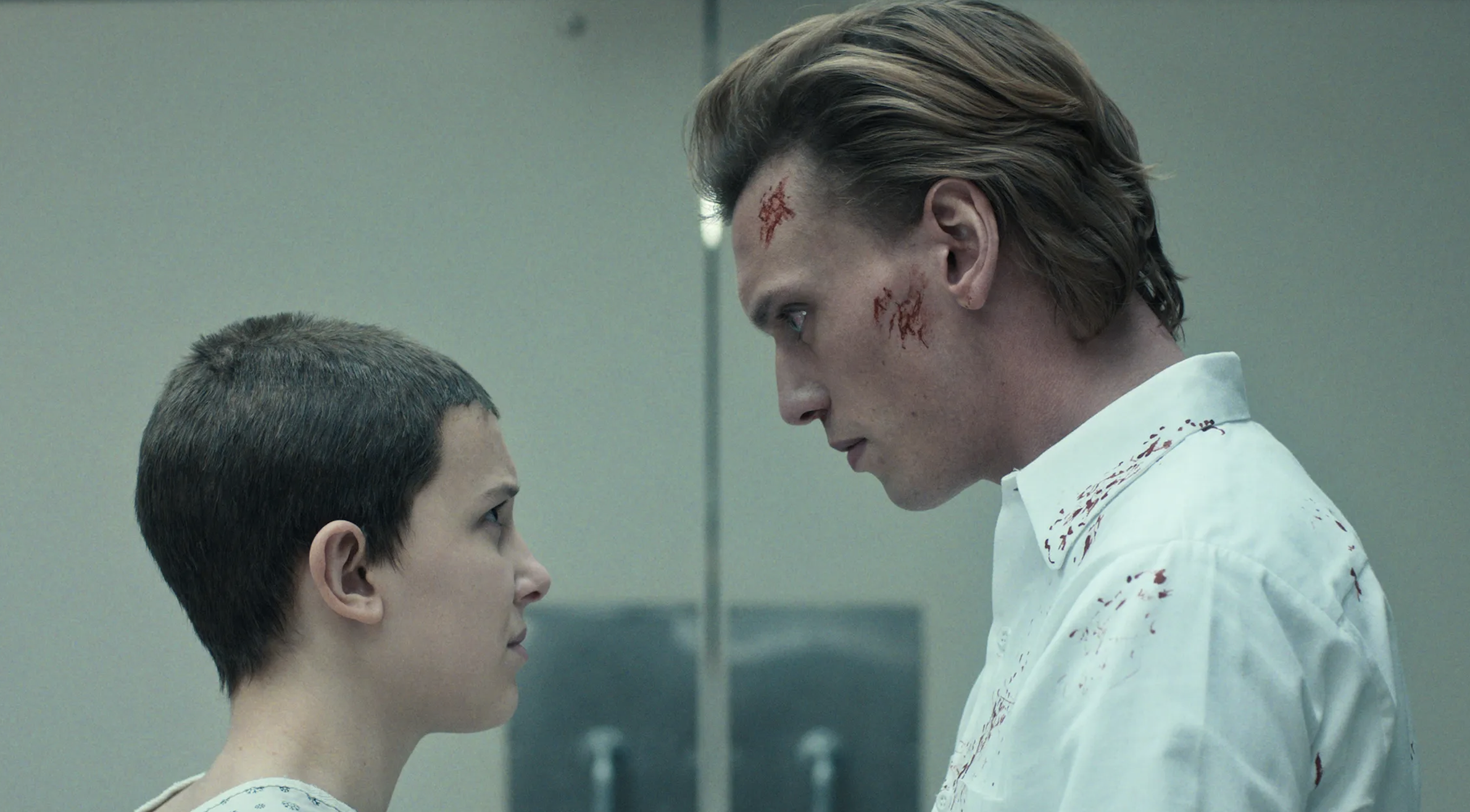 Millie Bobby brown as Eleven and Jamie Campbell Bower as a blood covered One