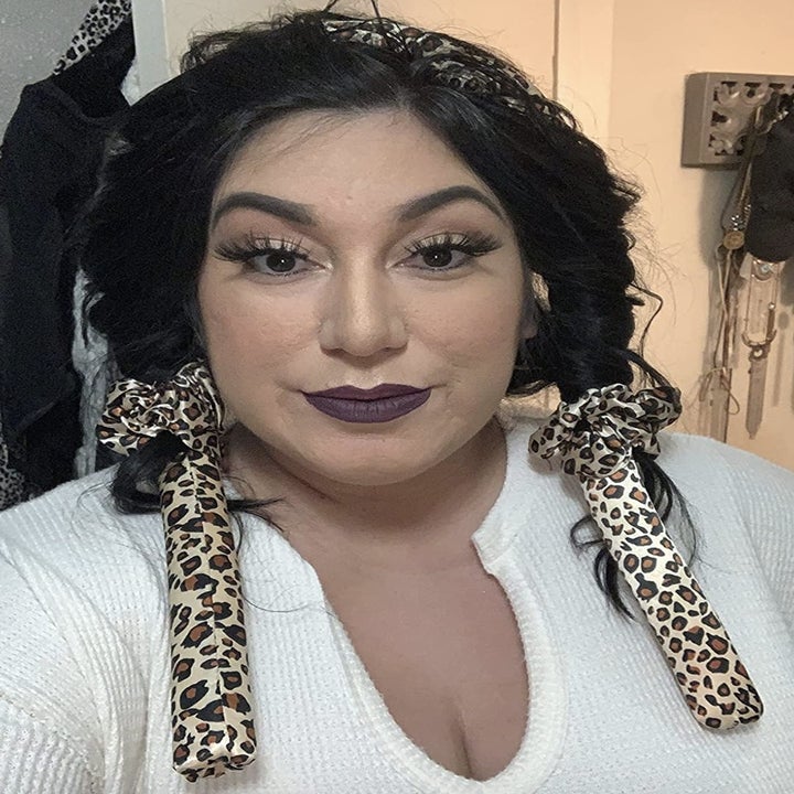 reviewer wearing the curlers
