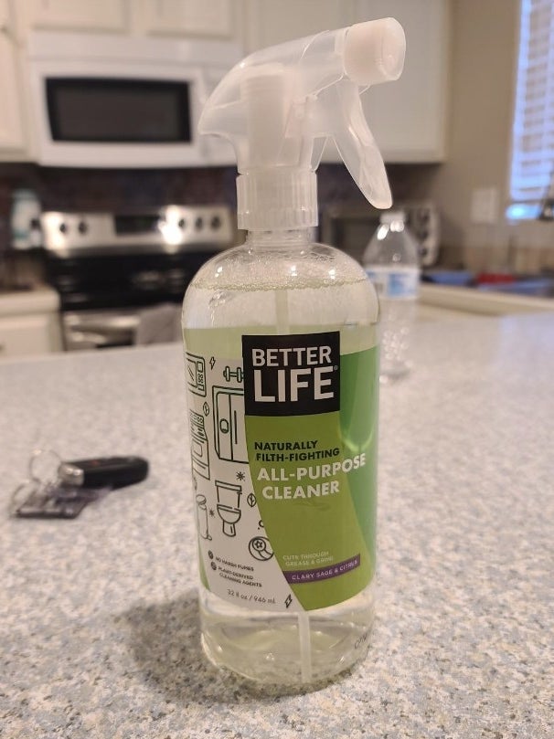 A reviewer&#x27;s photo of the white, green and clear bottle